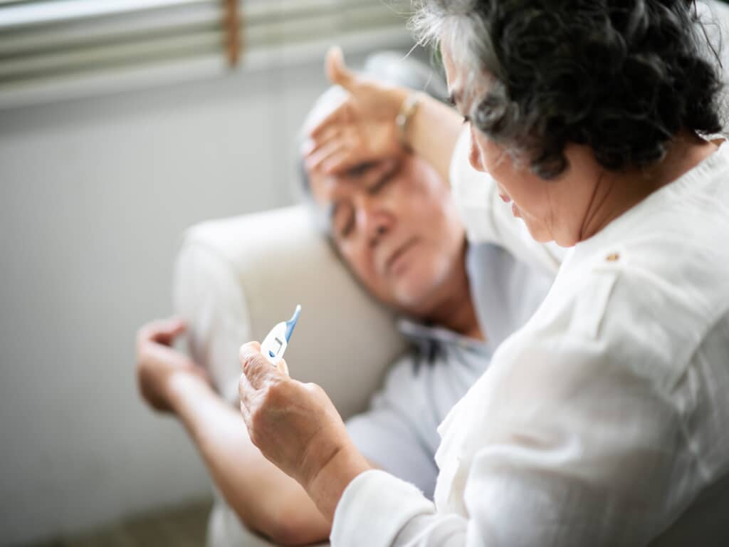 a woman caring for her elderly parent